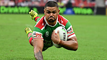 Latrell Mitchell scoring a try against the Dolphins.