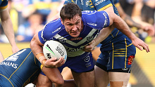 Josh Jackson of the Bulldogs is tackled during their round 23 match against the Eels on August 20, 2022.