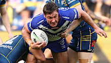 Josh Jackson of the Bulldogs is tackled during their round 23 match against the Eels on August 20, 2022.