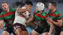 Jaxson Paulo is tackled by Jye Gray, Damien Cook and Tom Burgess.