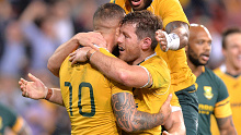 Quade Cooper and Samu Kerevi congratulate Bernard Foley after his 2016 try.