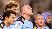 Angus Bell of the Waratahs and his team mates look dejected after a Brumbies try.