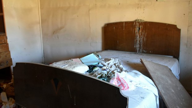 Another of the hotel bedrooms, with clothes strewn over the bed.