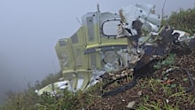 This photo provided by the Indonesian National Search and Rescue Agency (BASARNAS) shows debris of an ATR 42-500 turboprop airplane at Mount Bulusaraung in South Sulawesi province, Indonesia, Sunday, Jan. 18, 2026, after the aircraft lost contact Saturday. (BASARNAS via AP)