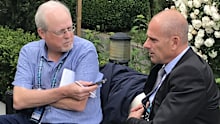 Howard Fendrich, left, interviews former French tennis player Guy Forget at the 2019 French Open.