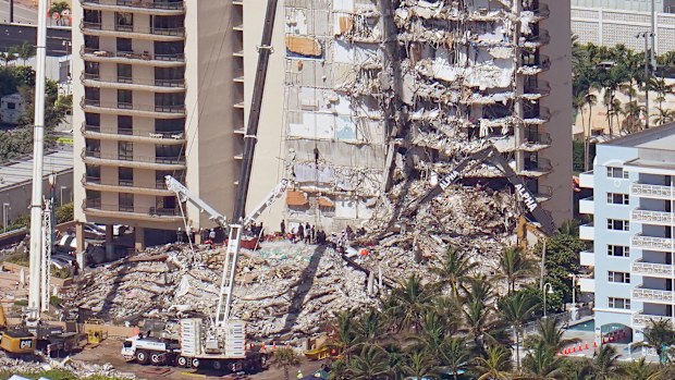 The pancake collapse of the building has frustrated efforts to reach anyone who may have survived in a pocket of space.