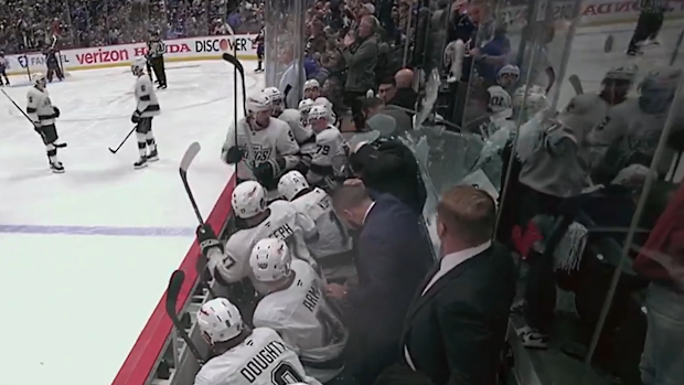 The glass hit LA's head coach and players on the bench. 
