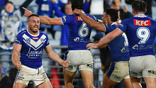 Josh Reynolds celebrates the Bulldogs' incredible golden point win with his teammates.