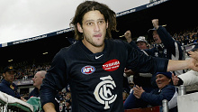 MELBOURNE, AUSTRALIA - APRIL  24: Brendan Fevola #25 for the Blues is congratulated by fans after winning the round five AFL match between the Carlton Blues and the West Coast Eagles at Optus Oval April 24, 2004 in Melbourne, Australia. (Photo by Mark Dadswell/Getty Images)  *** Local Caption *** Brendan Fevola