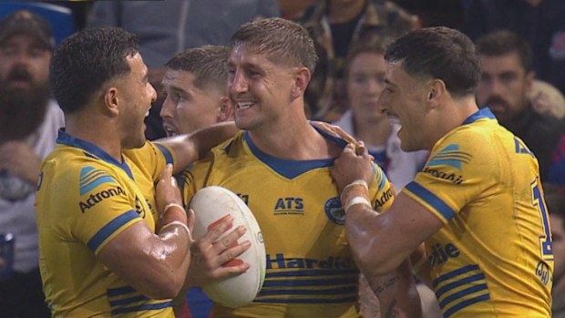 Zac Lomax celebrates scoring a try.