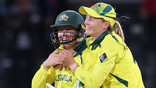 Alyssa Healy and Meg Lanning celebrate Australia's victory in the 2022 ICC Women's Cricket World Cup final.
