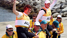 Australia's 49er crew of Nathan Outteridge and Iain Jensen are carried by teammates after winning Olympic gold.