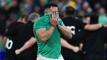 Ireland's Jack Conan covers his face after losing to New Zealand in the quarter-final.