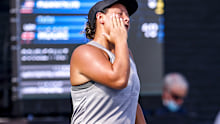 CLEVELAND, OH - AUGUST 22: Tara Moore of Great Britain slaps herself in the face after missing a shot during the first set of her match against Catherine Harrison of USA at Jacobs Pavilion on August 22, 2021 in Cleveland, Ohio. (Photo by Lauren Bacho/Getty Images)