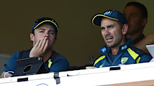 Travis Head and Justin Langer in 2018. 