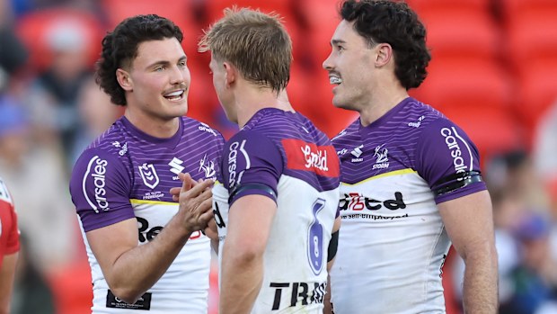 NEWCASTLE, AUSTRALIA - JULY 12: Nick Meaney, Tyran Wishart and Jonah Pezet of the Storm react to their sides win during the round 19 NRL match between Newcastle Knights and Melbourne Storm at McDonald Jones Stadium, on July 12, 2025, in Newcastle, Australia. (Photo by Scott Gardiner/Getty Images)