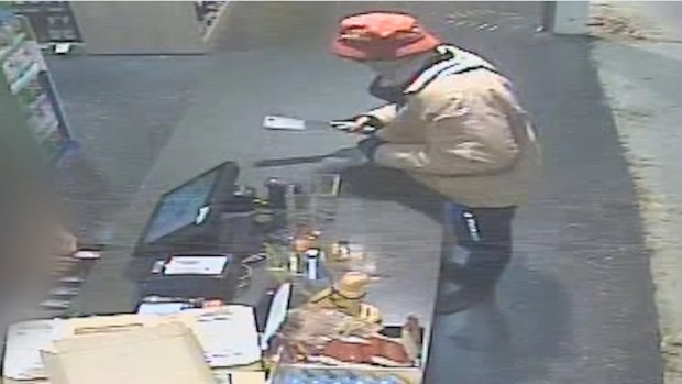 The man can be seen entering a store on Dohles Rocks Road in Murrumba Downs armed with a meat cleaver at 7.30pm on June 7. 