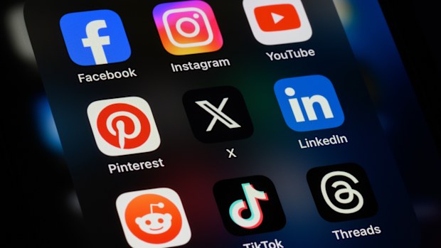 Toronto, Canada - September 24, 2023:  Popular social media apps on an Apple iPhone: Facebook, Instagram, YouTube, Pinterest, X (formerly Twitter), LinkedIn, Reddit, TikTok, and Threads.