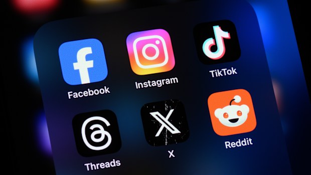 Toronto, Canada - August 22, 2024:    Popular social media apps on an Apple iPhone: Facebook, Instagram, TikTok, Threads, X (formerly Twitter), and Reddit.