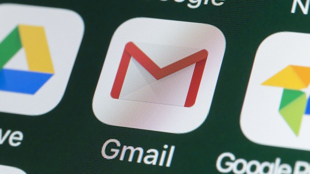 London, UK - July 31, 2018: The buttons of the app Gmail, surrounded by Google, Google Photos, Google Drive and other apps on the screen of an iPhone.