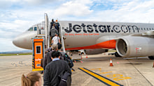 Launceston, Australia: December 11, 2019: Passengers boarding a Jetstar flight from Launceston Airport to Tullamarine Airport in Melbourne, Tasmania, Australia.