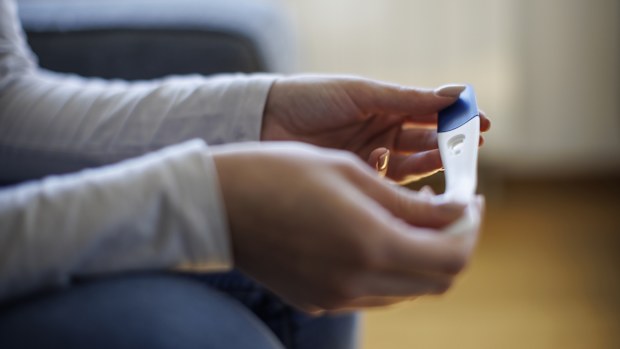 Woman waiting for pregnancy test result