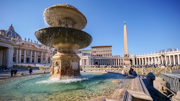 Vatican, March 09 -- A Bernini fountain in the majestic square of St Peter's Basilica, surrounded by the colonnade designed and built by Bernini himself in 1655. Characterized by giant columns and pilasters, the immense facade of San Pietro (118 meters wide and 48 high), was conceived by the architect Carlo Maderno to complete Michelangelo's previous project and built between 1608 and 1614. The Basilica of St. Peter's is the center of the Catholic religion, one of the most visited places in the 