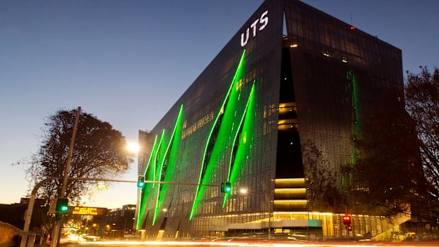 Sydney, Australia - May 8, 2014: Traffic moves past the University of Technology Sydney (UTS) at dusk. Pictured is the new Broadway/ITE  Building, which features a gill-like facade.