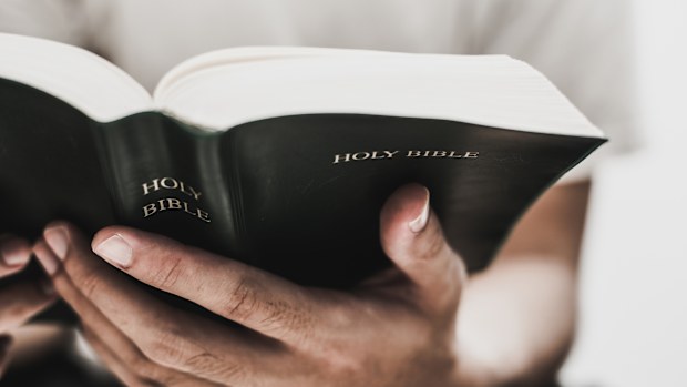 Closeup shot of reading holy bible.