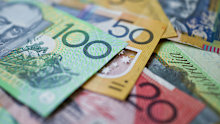 Australian money background showing $100, $50 and $20 notes with a shallow depth of field.