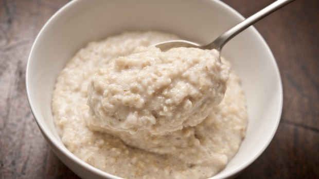 bowl of Oatmeal ( Porridge ) from above with spoon.