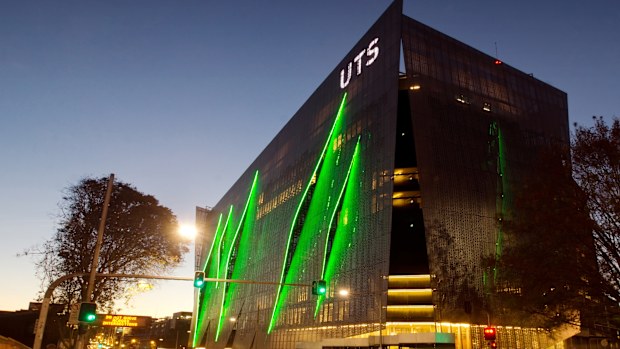 Sydney, Australia - May 8, 2014: Traffic moves past the University of Technology Sydney (UTS) at dusk. Pictured is the new Broadway/ITE  Building, which features a gill-like facade.
