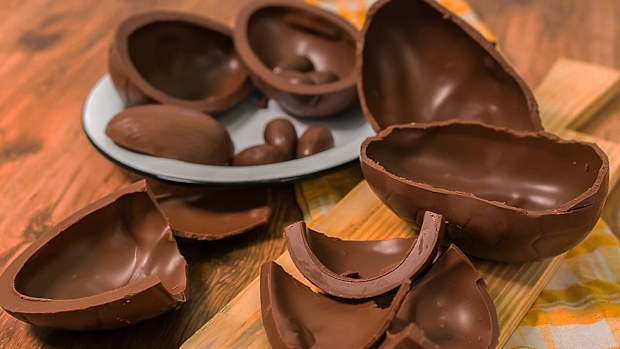 chocolate eggs on wooden background.
