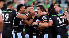 Nicho Hynes celebrates a try with his Sharks teammates. 