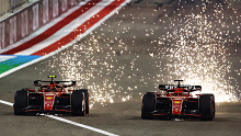 Sparks fly from the cars of Carlos Sainz and Charles Leclerc driving the Ferrari SF-24 in Bahrain.