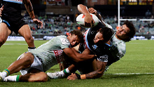 CANBERRA, AUSTRALIA - APRIL 28: Jesse Ramien of the Sharks scores a try during the round eight NRL match between Canberra Raiders and Cronulla Sharks at GIO Stadium, on April 28, 2024, in Canberra, Australia. (Photo by Brendon Thorne/Getty Images)