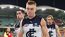 Patrick Cripps of the Blues and Jacob Weitering lead the team off.