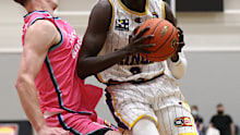 Matur Maker of the Kings under pressure from Finn Delany of the Breakers.