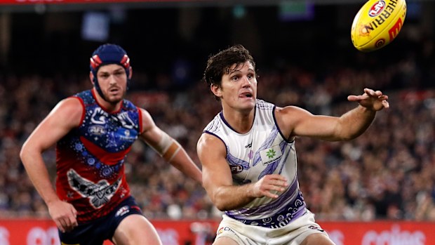Fremantle's Lachie Schultz and Melbourne's Angus Brayshaw.