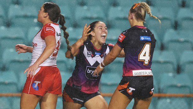 Rebecca Pollard of the Tigers celebrates scoring a try.