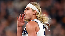 Bailey Smith of the Cats celebrates kicking a goal.