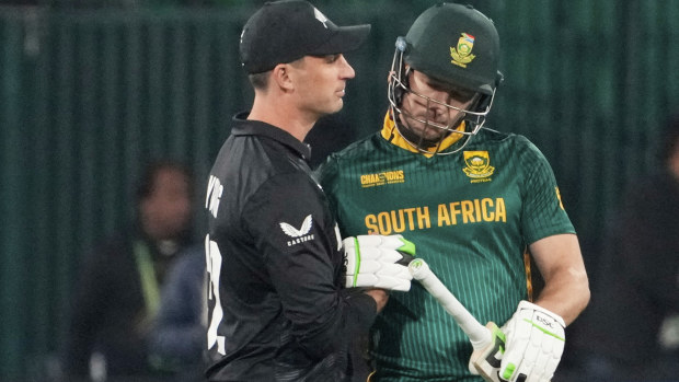 South Africa's David Miller, right, is congratulated by New Zealand's Will Young after completing his century.