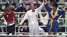 Italy referee Aldo Leoni holding up hand of victorious South Korea Park Si-Hun (R) after winning vs upset USA Roy Jones Jr. (L) after Light Middleweight Final at Chamshil Students' Gymnasium. Park defeated Jones for gold medal on controversial decision by judges. Seoul, South Korea 10/2/1988 CREDIT: John Iacono (Photo by John Iacono /Sports Illustrated via Getty Images) (Set Number: X37085 )