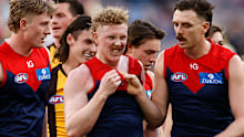 Jake Lever (right) drags teammate Clayton Oliver away from a wrestle during the round 23 AFL match between Melbourne Demons and Hawthorn Hawks at Melbourne Cricket Ground, on August 20, 2023, in Melbourne, Australia. 