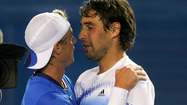 MELBOURNE, AUSTRALIA - JANUARY 20:  Marcos Baghdatis of Cyprus and Lleyton Hewitt of Australia hug after their match that Hewitt won in the fifth set during the third round on day six of the Australian Open 2008 at Melbourne Park in the early morning hours of January 20, 2008 in Melbourne, Australia.  (Photo by Ezra Shaw/Getty Images)