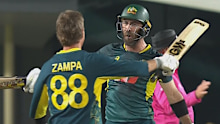 Glenn Maxwell celebrates with Adam Zampa. 