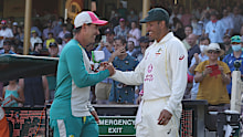 Usman Khawaja is congratulated by Justin Langer.