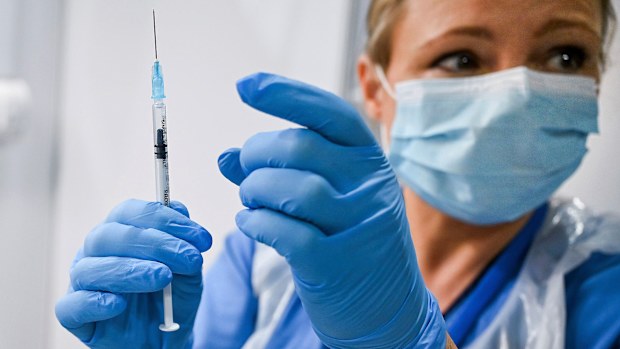 Grace Thomson (left) receives the first of two Pfizer/BioNTech Covid-19 vaccine jabs, administered Paula McMahon, at the NHS Louisa Jordan Hospital in Glasgow, on the first day of the largest immunisation programme in the UK's history. Care home workers, NHS staff and people aged 80 and over began receiving the jab this morning. PA Photo. Picture date: Tuesday December 8, 2020. See PA story HEALTH Coronavirus. Photo credit should read: Jeff Mitchell/PA Wire