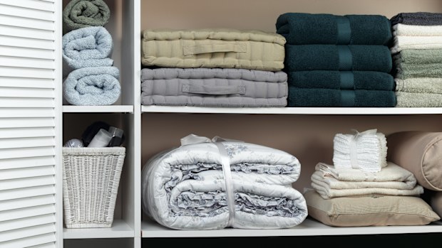 Anyone with one knows - linen closets often turn into the place you shove random things you don't have room for anywhere else.