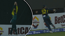 Glenn Maxwell flicks the ball back in from the boundary